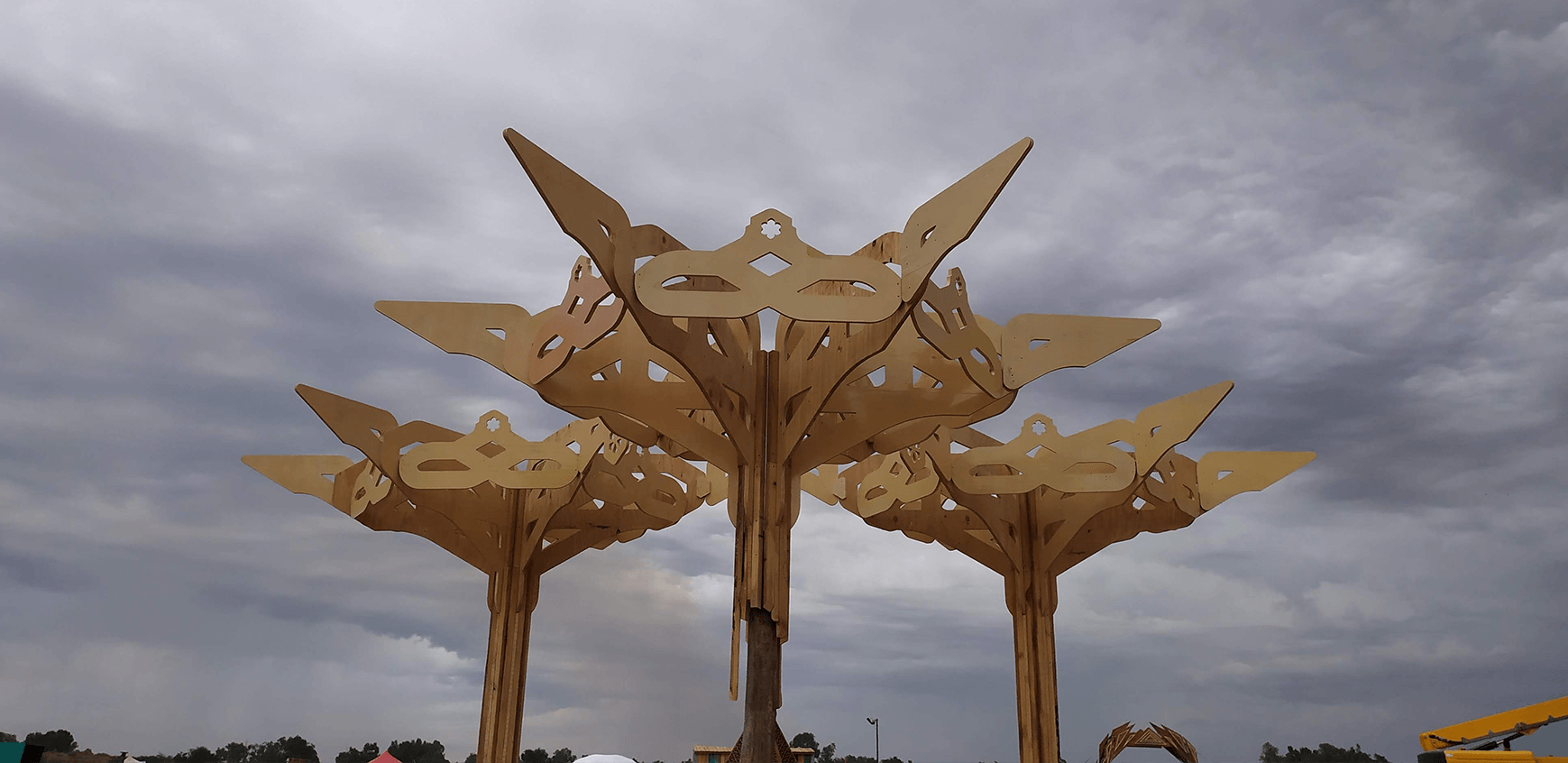 A geometric Tree structure, s meeting and seating area set up over multiple years at Bazique Festival.