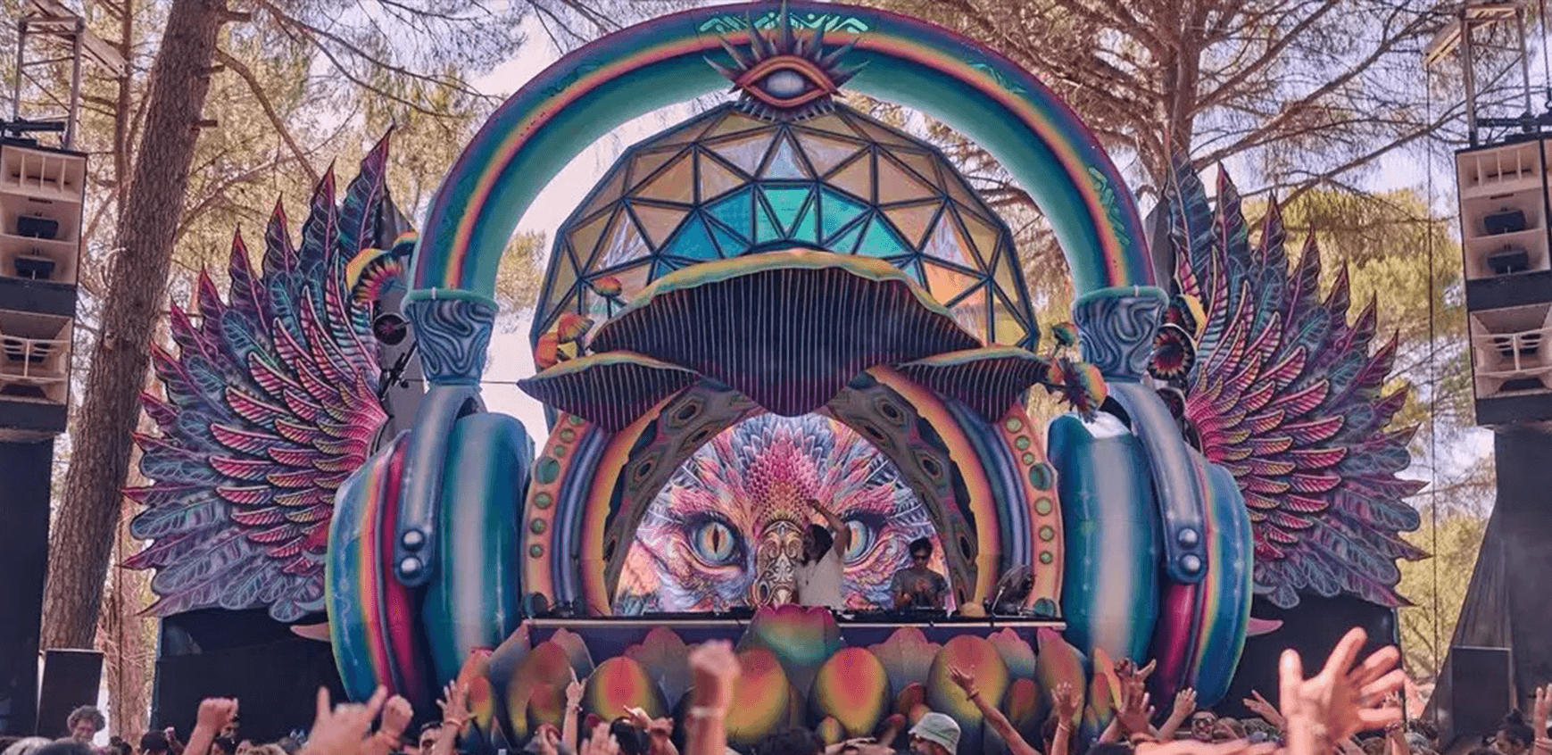 A giant pair of headphones infected with mushrooms flying through space